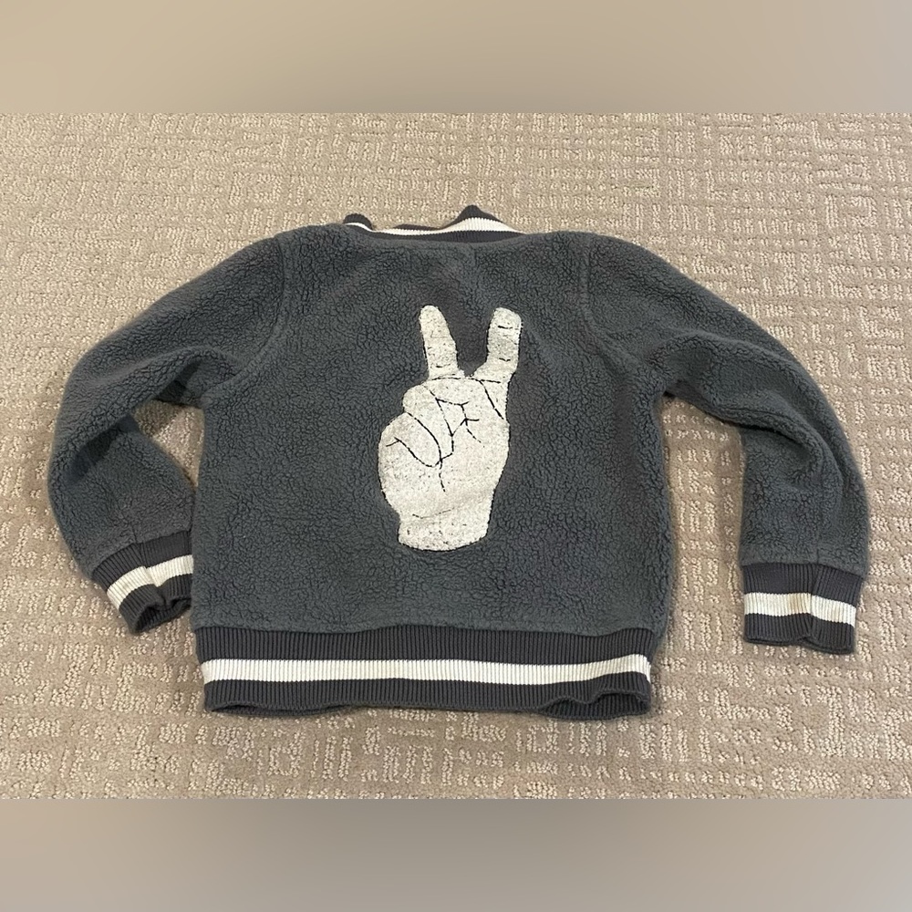 monica & andy peace sign varsity jacket